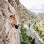 Caucasian female rock climbing in Colorado
